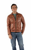 Man wearing a brown leather jacket and blue jeans on a white background