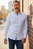 man leaning against brick wall