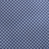Navy blue fabric with a small white geometric pattern
