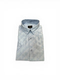 Folded light blue tie-dye shirt on a white background