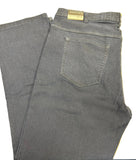 Folded dark blue jeans on a wooden surface