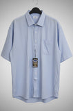 Light blue shirt on a hanger with a gray background