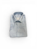 Folded light blue  patterned shirt on a white background