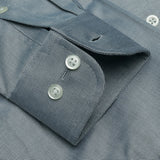 Close-up of a dark gray textured fabric with buttons