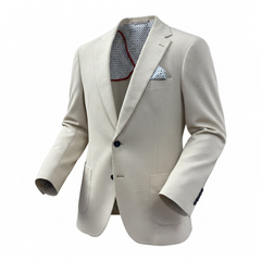 Beige blazer with a patterned shirt and pocket square on a white background