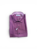 Folded purple dress shirt with a patterned interior on a white background