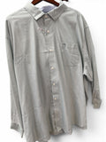 Gray patterned button-up shirt on a hanger against a white background