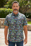 Man wearing a tropical patterned shirt outdoors