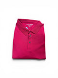Folded red polo shirt with 'Elite Sport' branding on a white background