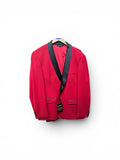 Red blazer with black lapels on a white background
