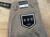 tan pants with Bertini label and Activ Performance Series badge on a wooden surface