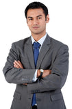 Man in a gray suit with arms crossed on a white background