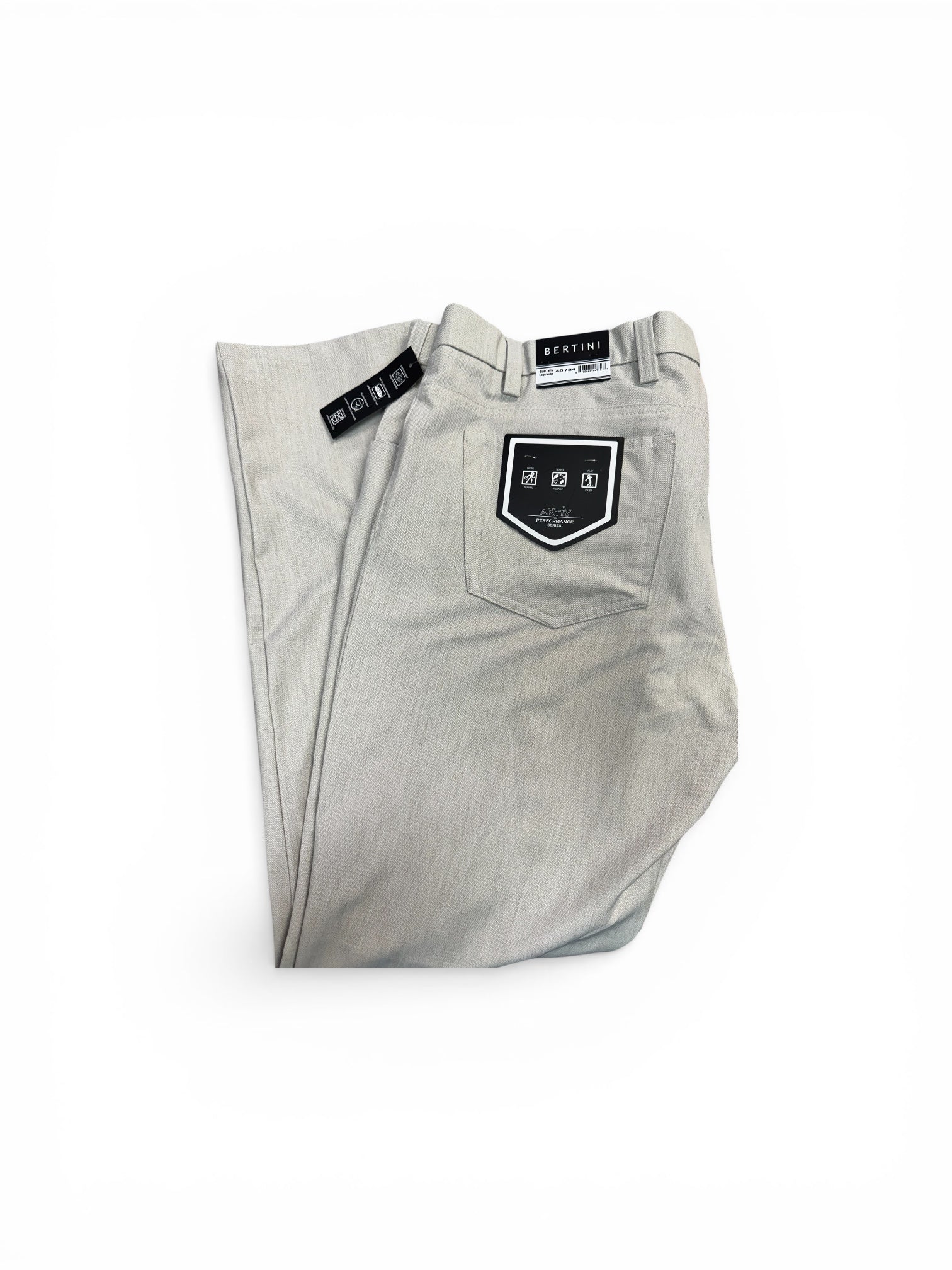 Folded bone colored pants with brand labels on a white background