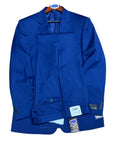 cobalt Blue jacket with a tag on a wooden surface