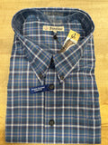 Folded blue plaid shirt with tags on a wooden surface
