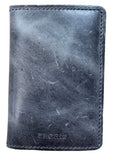 A dark gray distressed leather bifold wallet with visible stitching and a debossed 'SECGRID' logo, placed on a light brown wooden surface.