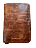 A brown leather Secrid passport holder wallet with a distressed finish, placed on a light wood grain surface.