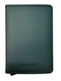 A dark green leather Secrid card holder wallet with debossed branding, placed on a light wood grain surface.
