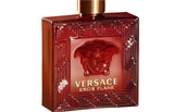 Versace perfume bottle with intricate design on an orange background